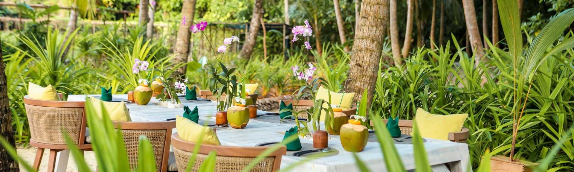 Dining table with fresh coconut water at Vakkaru Maldives